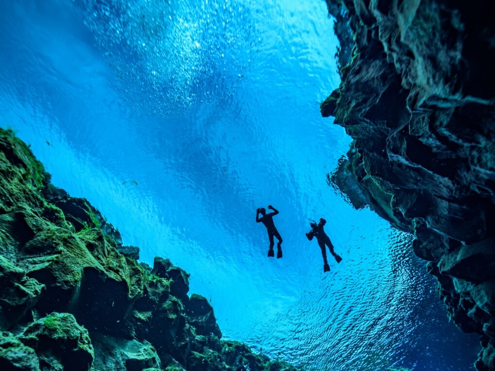Between Two Worlds: Amazing Underwater Adventurers in Iceland’s Silfra Fissure 